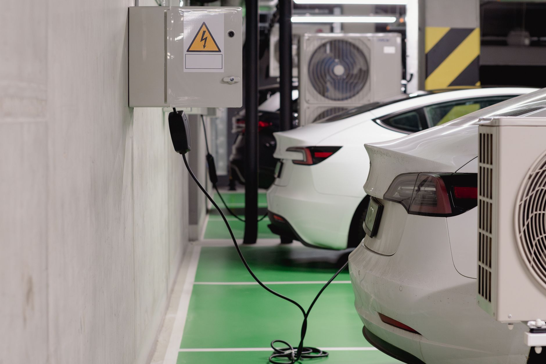 Electric vehicles charging at an indoor station in a modern facility