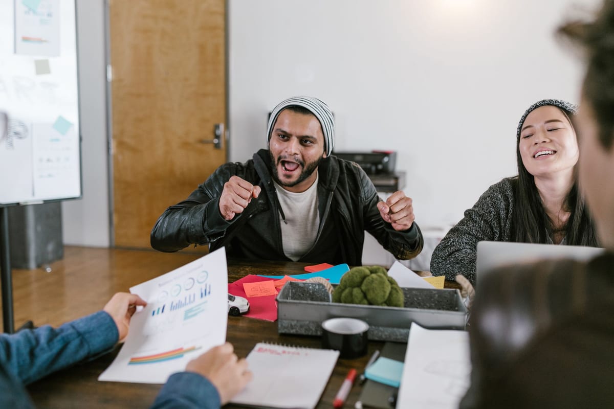 Young entrepreneurs collaborating in a startup office — brainstorming business ideas