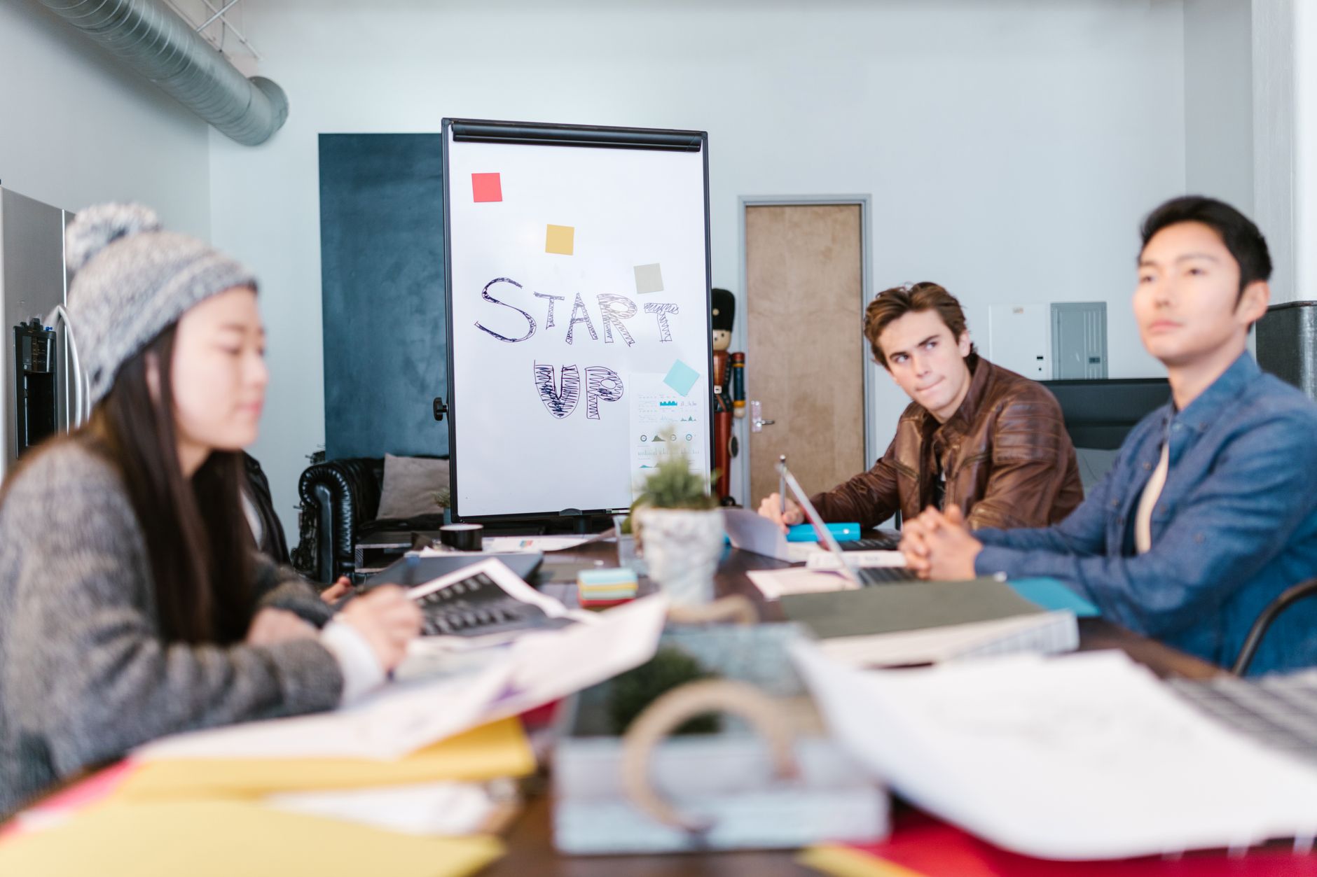 Founder pitching to investors in a boardroom meeting